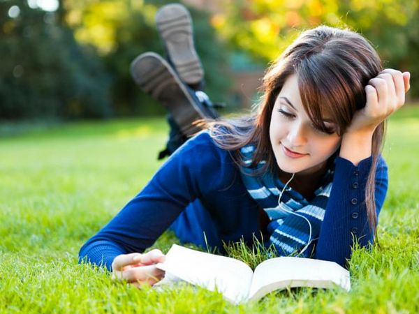 Girl Reading Book in Lawn