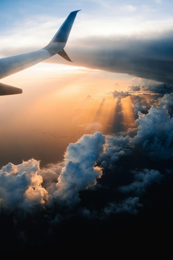 Airplane on sky during golden hour.