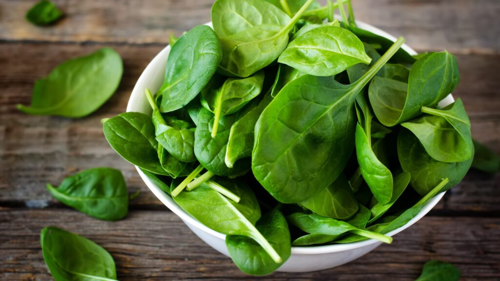 Spinach leaves in bowl.