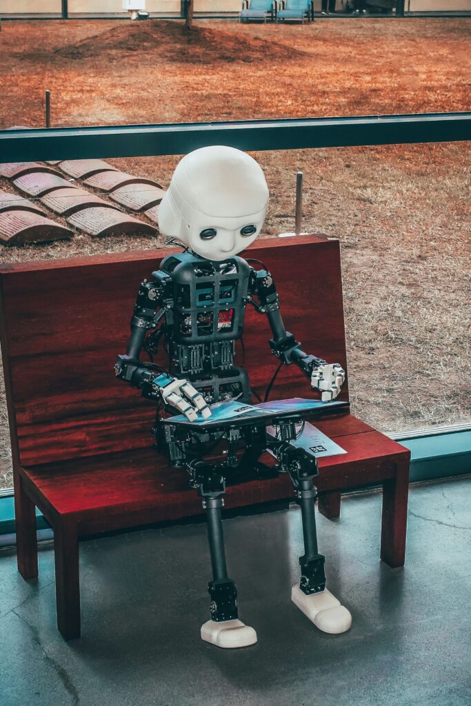 black and white robot on wooden table.