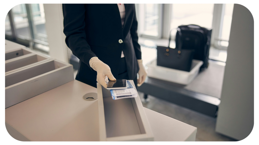 A person holding a phone and a passport.