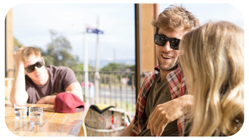 Man Sitting Beside Woman in Front of Table.