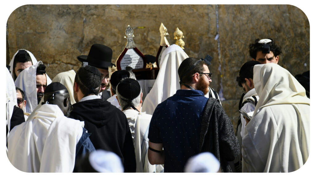 group of people wearing white robes.