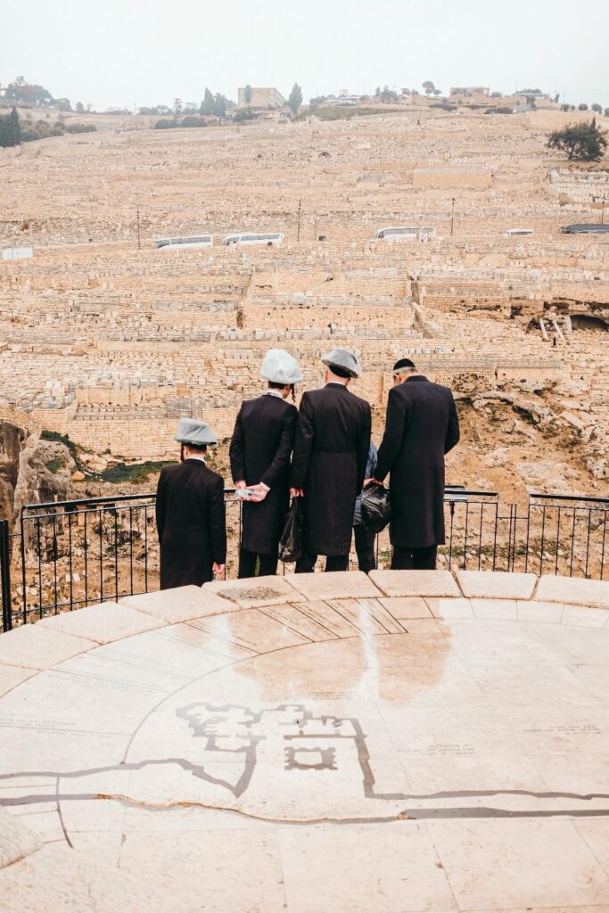 people standing on brown field during daytime.