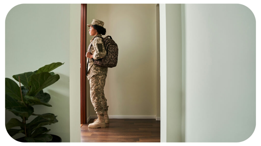 Full length view of the soldier woman wearing military uniform holding backpack.