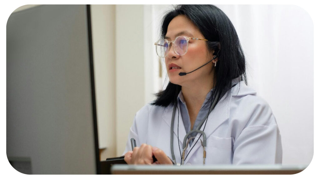 asian woman doctor visit patient video call online diagnose symptom at clinic.