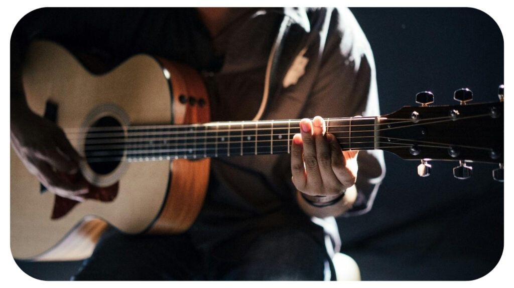 person playing guitar.