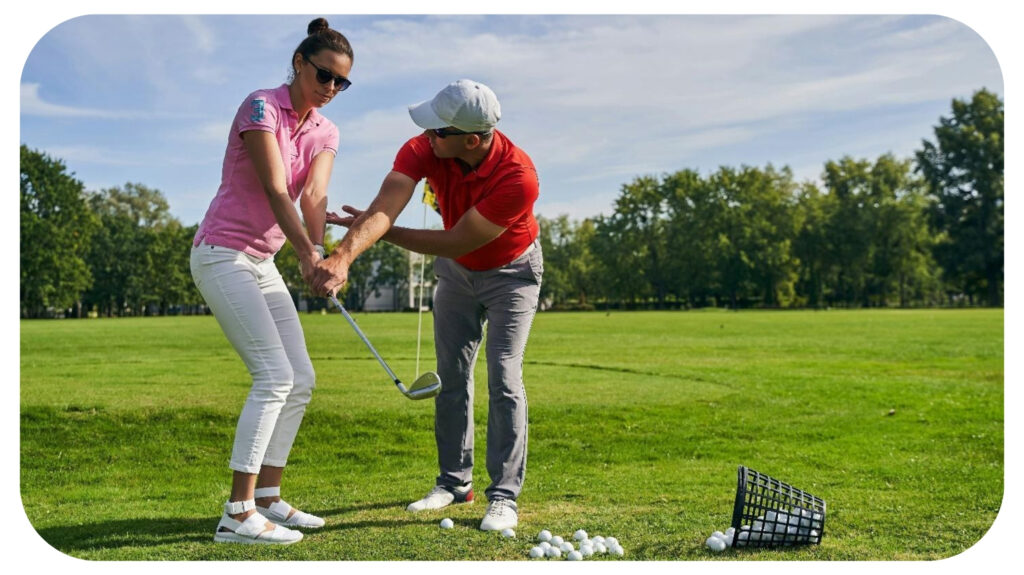 Serious beginner golfer in sunglasses learning to hold a club assisted by her personal coach.