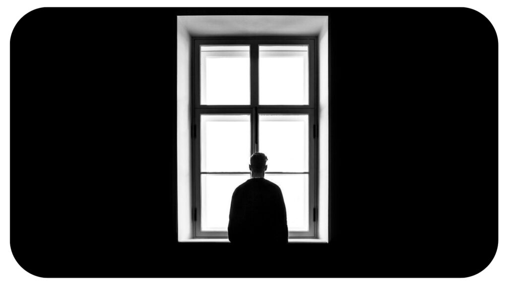 man standing in front of the window.